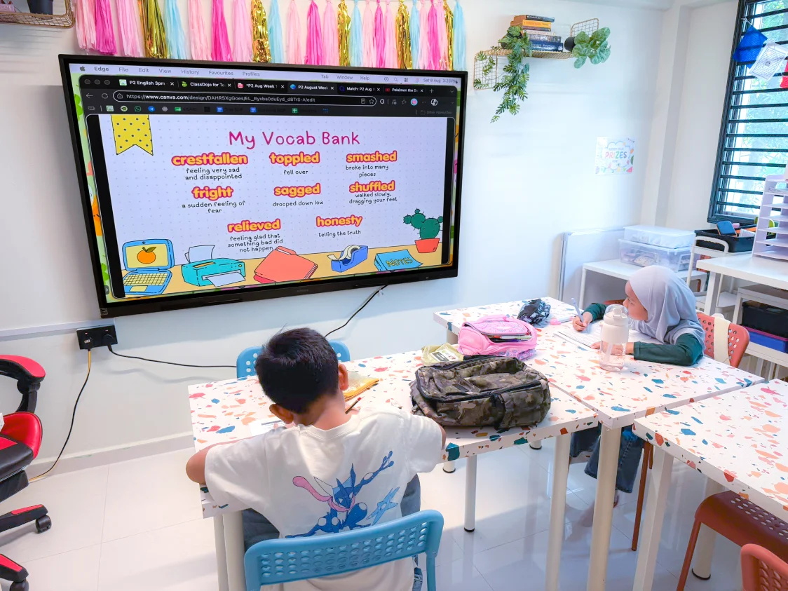 A Happy Quills lesson, with the vocabulary bank shown on the classroom screen